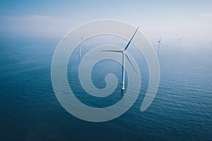 Wind turbine. Aerial view of wind turbines or windmills farm field in blue sea in Finland