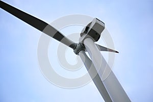 Wind turbine against beautiful sky. Alternative energy source