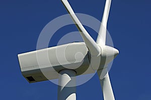 Wind turbine against blue sky