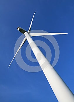 Wind turbine against a clear blue sky