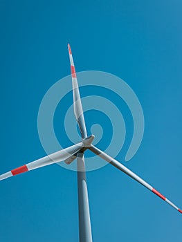 Wind turbine with beautiful blue sky photo