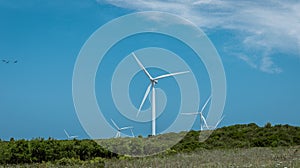 Wind turbine with beautiful blue sky photo