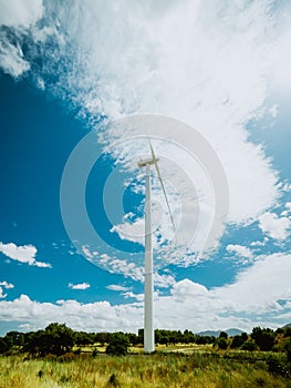 Wind turbine with beautiful blue sky photo