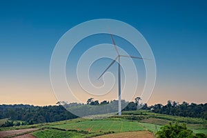 Wind turbine on beautiful sunny summer autumn mountain landscape..