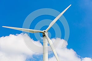 Wind turbine in blue background, close-up. Renewable energy concept. Windy area