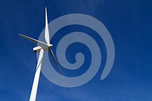 Wind turbine on blue sky