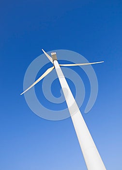 Wind turbine on blue sky