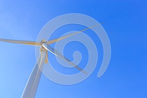 Wind turbine on blue sky