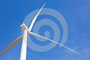 Wind turbine on blue sky
