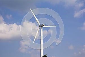 Wind turbine with blue sky, renewable energy