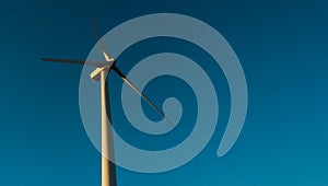 Wind turbine on blue sky. Wind turbines generating electricity