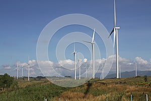 Wind turbine on clear blue sky, Renewable electricity Energy, sustainable conservation power development concept on green field