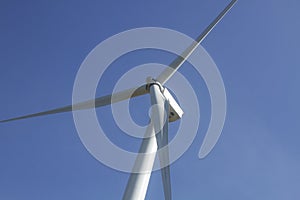 Wind turbine on clear blue sky, Renewable electricity Energy, sustainable conservation power development concept on green field, e