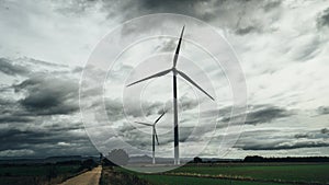 Wind turbine with a cloudy and gray sky photo