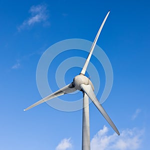 Wind turbine for energy generating with blue sky background