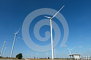 Wind turbine farm in the field - a renewable energy source