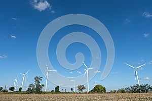 Wind turbine farm in the field - a renewable energy source