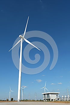 Wind turbine farm in the field - a renewable energy source