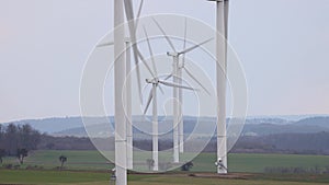 Wind turbine farm generating electricity in a beautiful landscape