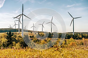 Wind turbine farm over blue sky