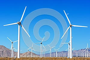 Wind turbine farm for renewal energy at San Gorgonio Pass from Indian Canyon Road near Palm Springs, California, USA