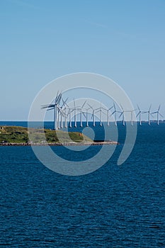 Wind turbine farm and small island in Baltic Sea between Germany