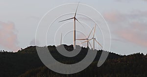 Wind turbine farm on top of hill