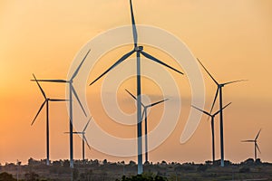 Wind turbine farm, Wind turbines silhouette at sunset.