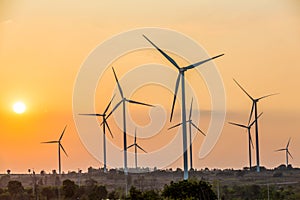 Wind turbine farm, Wind turbines silhouette at sunset.