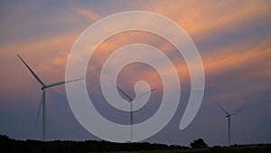 Wind turbine farm. Wind turbines under blue sky