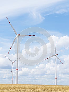 Wind turbine in front of bright blue sky