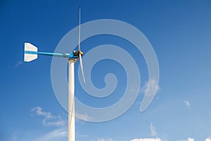Wind turbine generating electricity on blue sky with clounds,Windmills for electric power ecology concept