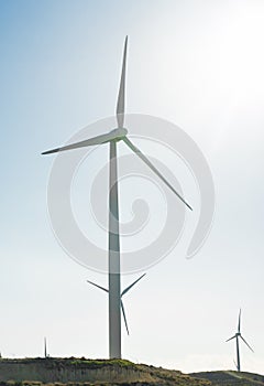 Wind turbine generating electricity with blue sky - energy conservation concept