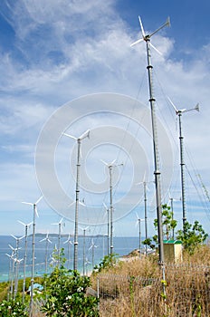 wind turbine generating electricity on hill