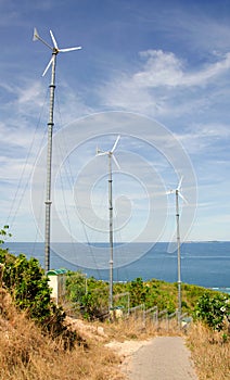 wind turbine generating electricity on hill