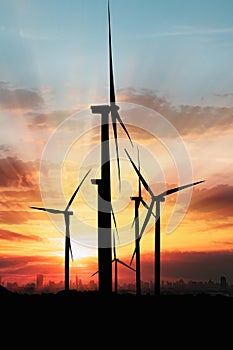 Wind turbine generating electricity on sky sunset background ,from wind power for environmental.