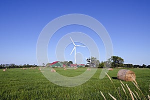 Wind turbine and hay bails
