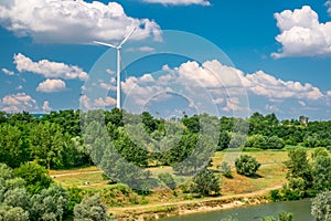 Wind turbine on the hill produces green clean energy