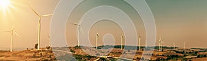 wind turbine on hill with sunlight. concept eco power energy in