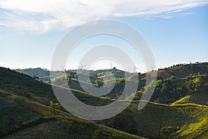 Wind turbine landscape natural energy green Eco power concept at wind turbines farm blue sky background