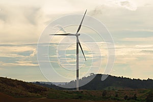 Wind turbine with the light of sunset. Alternatively referred to as a wind energy converter.