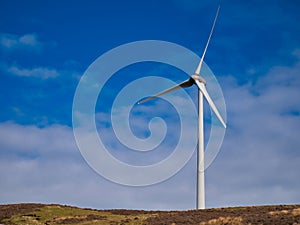 The wind turbine at Luggie\'s Knowe Windfarm near Lerwick in Shetland, UK. Taken on a sunny day.