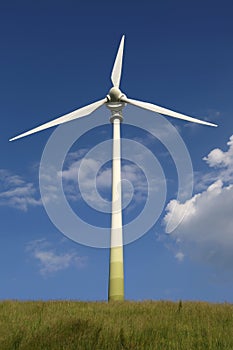 Wind turbine on a meadow green energy