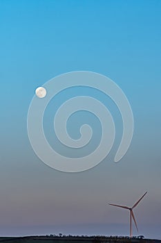 Wind Turbine and Moon Silhouette at Sunset in Devon