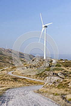 Wind turbine with offroad access trail photo