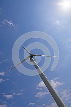 Wind turbine over blue sky