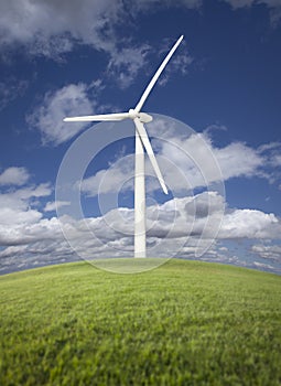 Wind Turbine Over Grass Field, Sky and Clouds