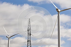 Wind turbine and power line. Clean alternative renewable energy.