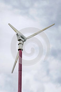 Wind turbine producing alternative energy. Wind turbines generating electricity with blue sky - energy conservation concept