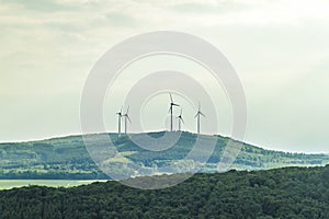 Wind turbine renewable energy source summer landscape with clear